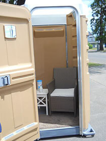 Private breastfeeding space in a portable restroom shell