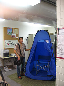 Private breastfeeding space in a pop-up tent indoors